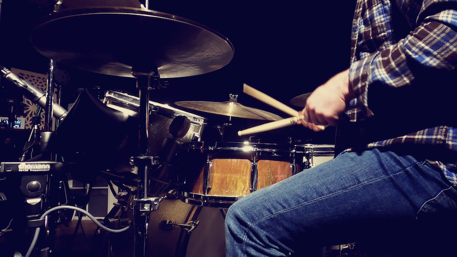 Online drum tutor playing funky drums